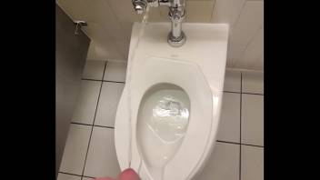 Inappropriately peeing all over and around a public toilet at the local movie theater bathroom